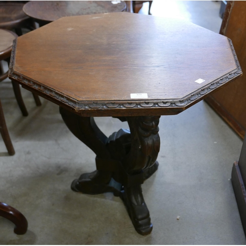 123 - A 19th Century Italian Baroque style carved oak octagonal lamp table