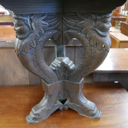 123 - A 19th Century Italian Baroque style carved oak octagonal lamp table