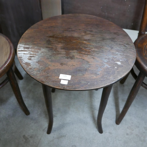 125 - A beech bentwood occasional table and two chairs