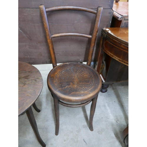 125 - A beech bentwood occasional table and two chairs