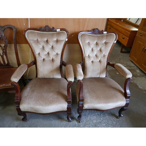 130 - A pair of Edward VII mahogany and fabric upholstered armchairs