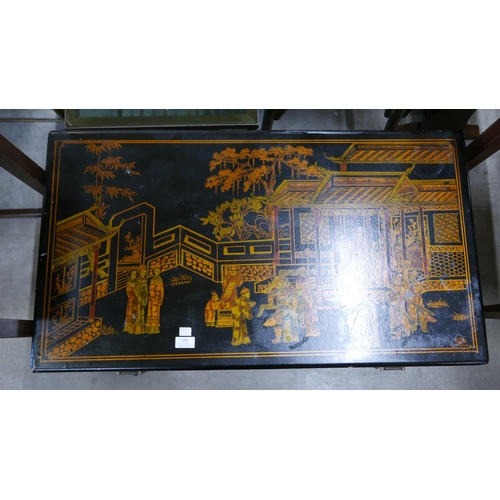 135 - An oriental black chinoiserie blanket box