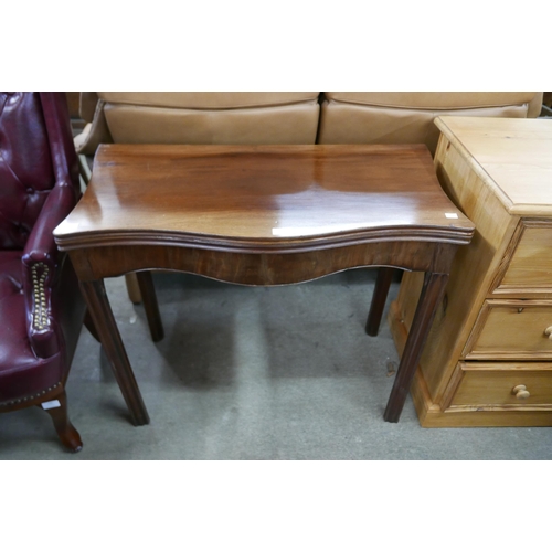 141 - A George III mahogany serpentine fold over table