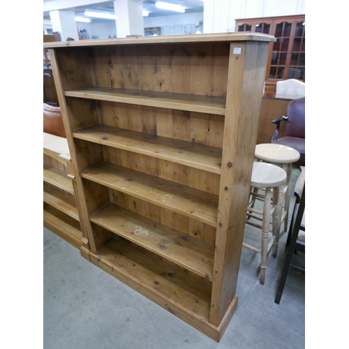 143 - Two pine open bookcases