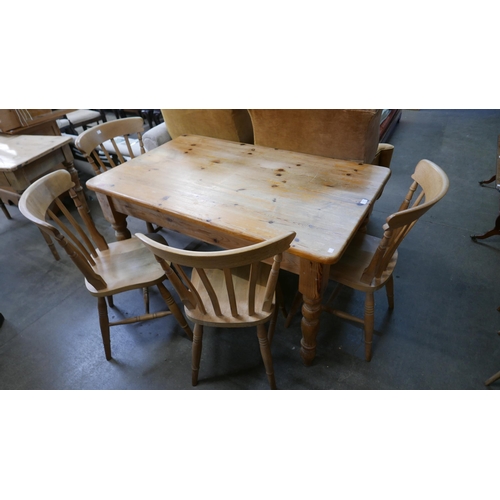 146 - A pine single drawer kitchen table and a four beech chairs