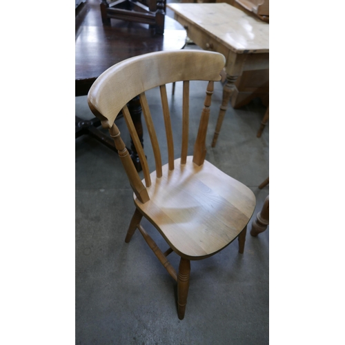 146 - A pine single drawer kitchen table and a four beech chairs