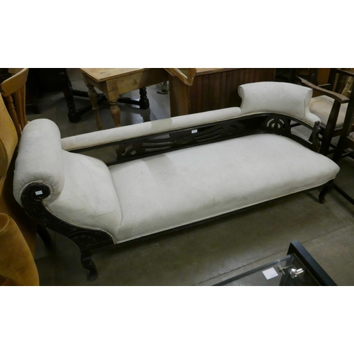 149 - A Victorian carved beech and fabric upholstered chaise longue