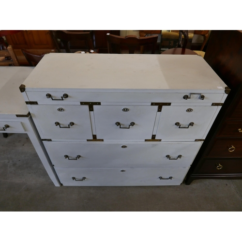 168 - A campaign style painted two drawer writing desk and matching chest of drawers