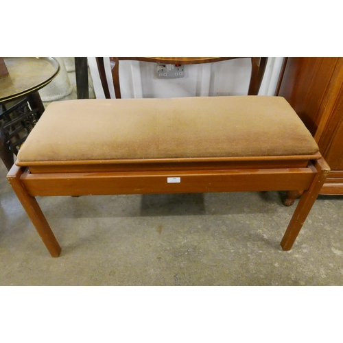 186 - A teak piano stool