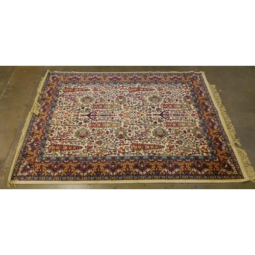 189 - An eastern cream ground rug