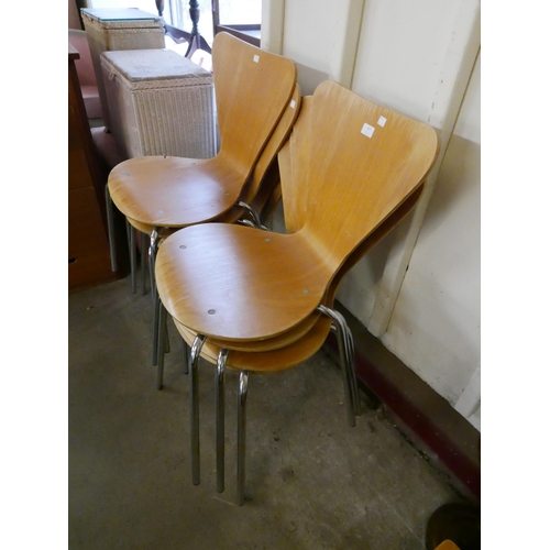 202 - A set of eight Fritz Hanson style chrome and bent plywood stacking chairs