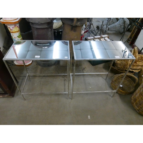 207 - A pair of chrome effect and mirrored topped side tables