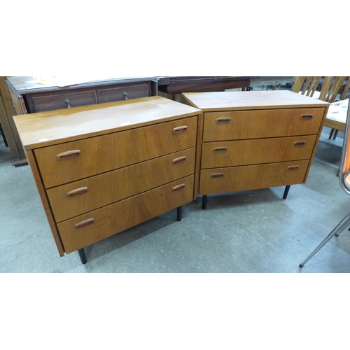 21 - A pair of Danish teak chests of drawers