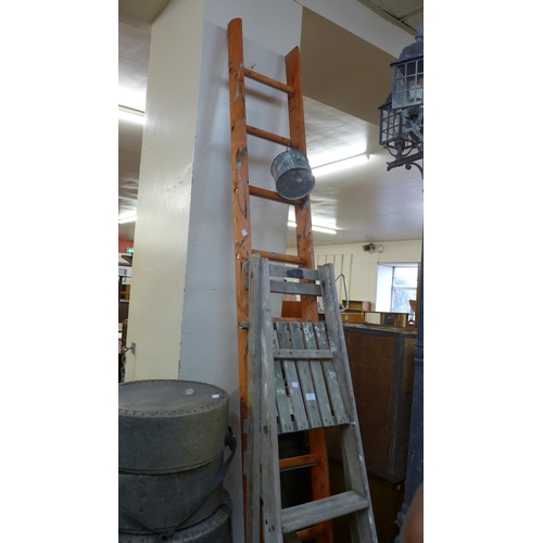 235 - Two painter's ladders and a painter's tin