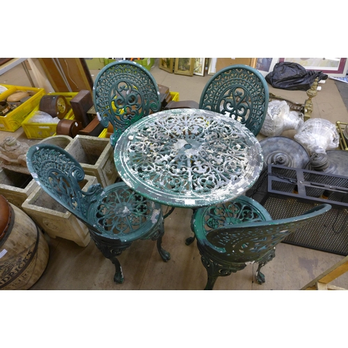 238 - A painted wrought alloy garden table and four chair