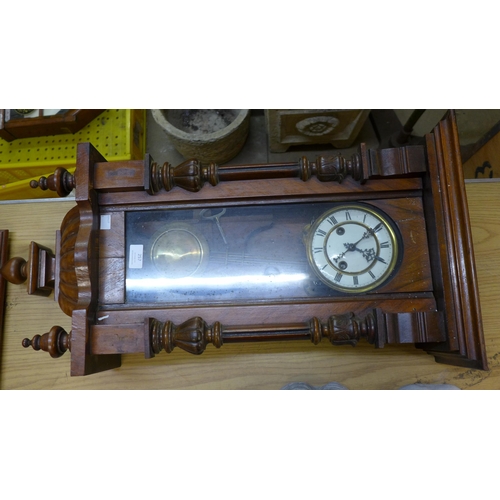 257 - A 19th Century walnut Vienna wall clock