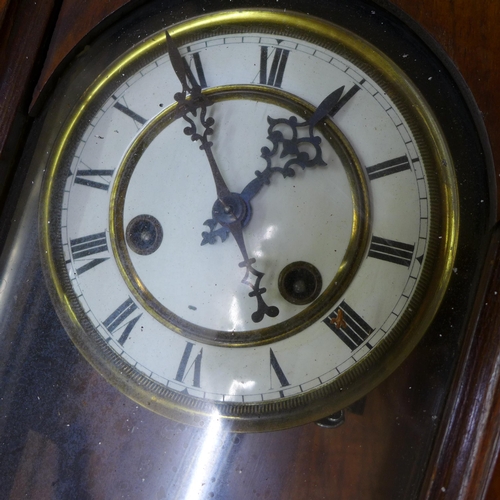 257 - A 19th Century walnut Vienna wall clock