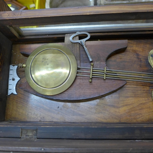 257 - A 19th Century walnut Vienna wall clock