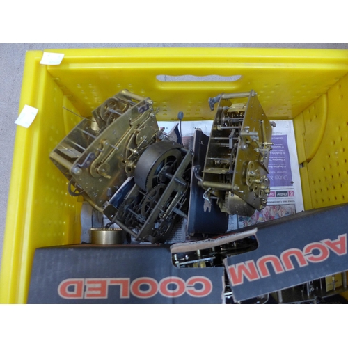 259 - Two boxes of assorted clock movements, pendulums, etc.