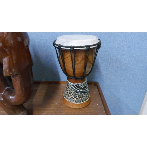 277 - An African drum and a wooden Indian carved wood elephant