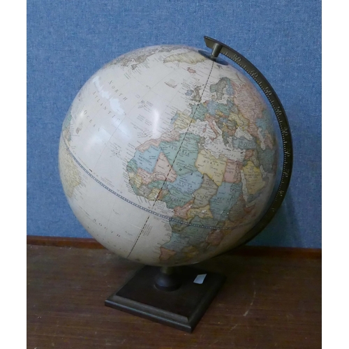 279 - A desk top terrestrial globe and a pair of Celtic porcelain two handled vases