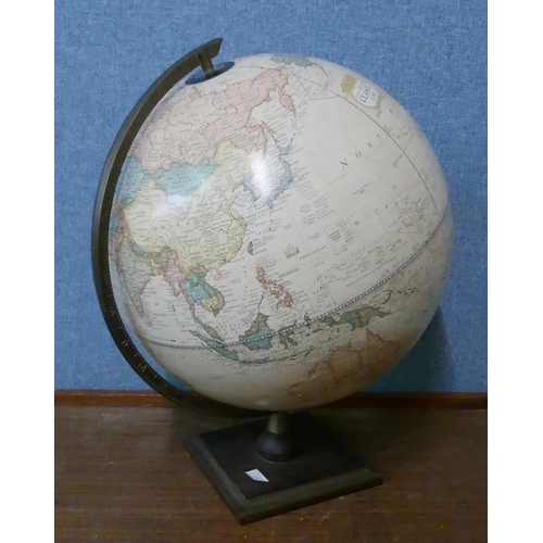 279 - A desk top terrestrial globe and a pair of Celtic porcelain two handled vases