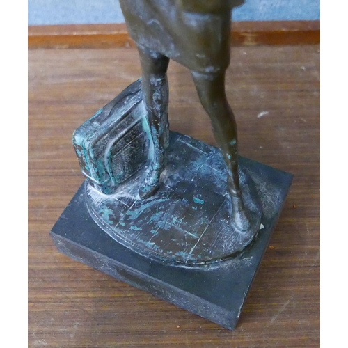 282 - A bronze figure of a female office worker