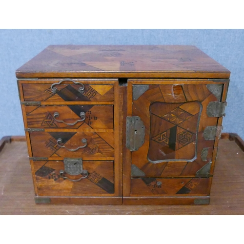 287 - A Japanese inlaid wooden table top kodansu cabinet