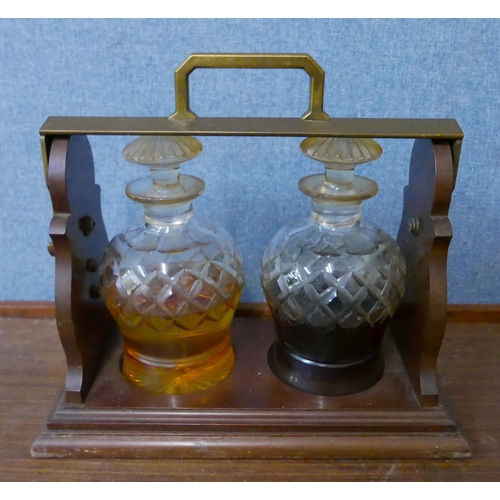 290 - A Betjemann's 62929 Patent mahogany and brass two bottle tantalus (no key)