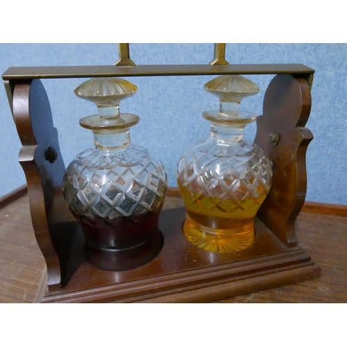 290 - A Betjemann's 62929 Patent mahogany and brass two bottle tantalus (no key)