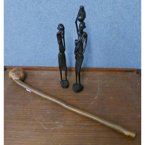 291 - An African wooden knobkerry and two carved figures