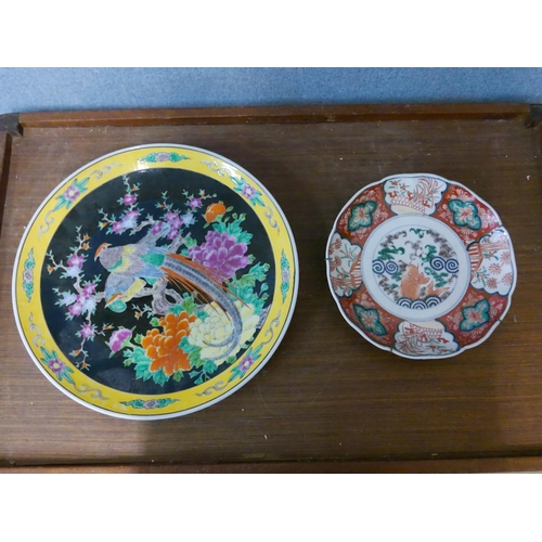 292 - A Japanese famille noir porcelain charger and an Imari pattern dish