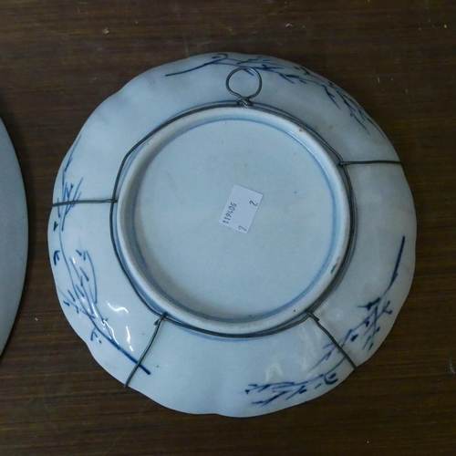 292 - A Japanese famille noir porcelain charger and an Imari pattern dish