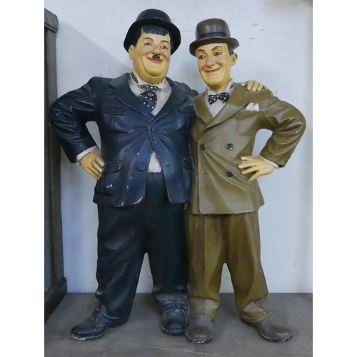 296 - A painted Laurel and Hardy figure