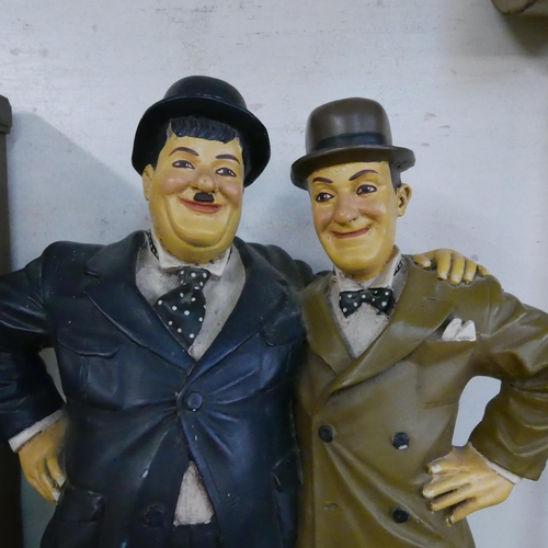 296 - A painted Laurel and Hardy figure