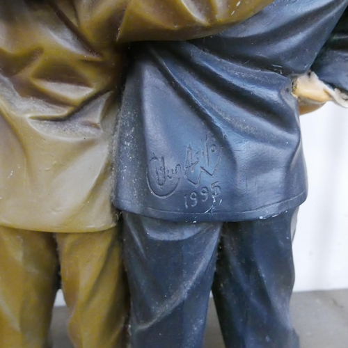 296 - A painted Laurel and Hardy figure