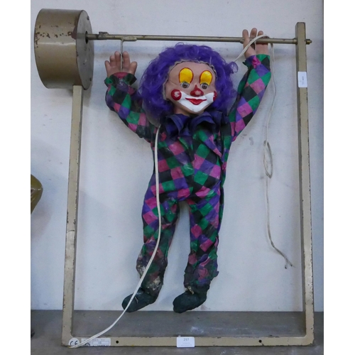 297 - A motorised shop display oscillating clown