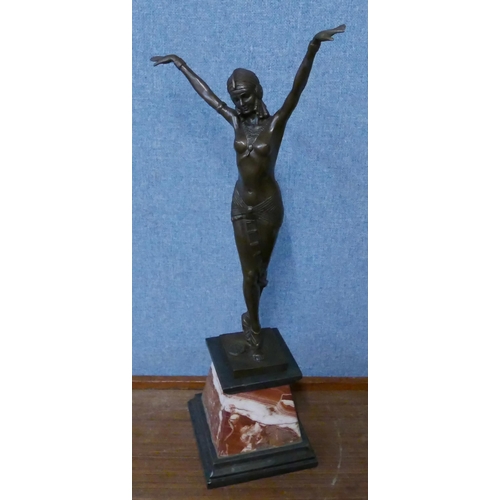 299 - An Art Deco style bronze figure of an exotic dancer, on rouge marble socle