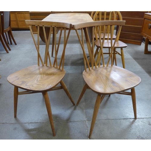 2A - A pair of Ercol elm and beech 376 model candlestick chairs