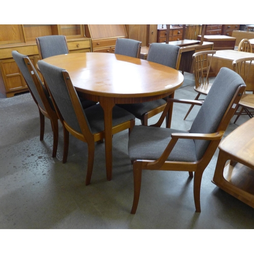 3 - A McIntosh teak extending dining table and six chairs