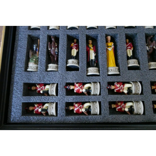 301 - A Napoleonic figural chess resin set, in a table top box with board