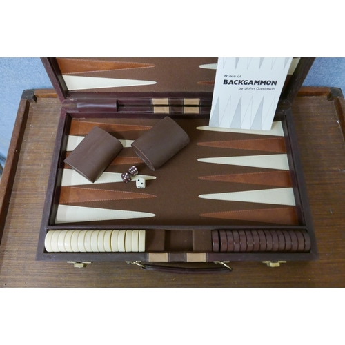 302 - A cased backgammon set