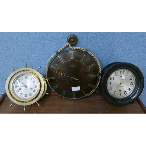 303 - A Waterbury brass ship's wheel wall clock and two others