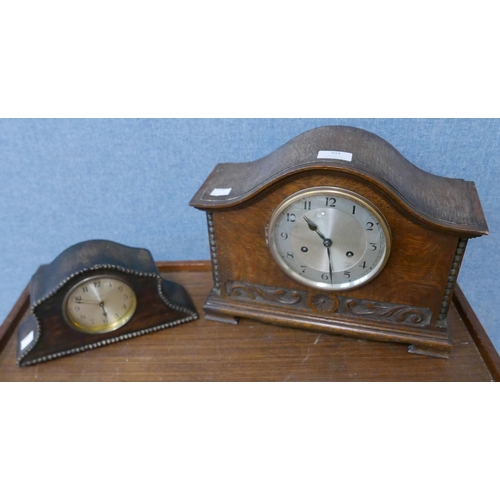 304 - Two early 20th Century carved oak mantel clocks