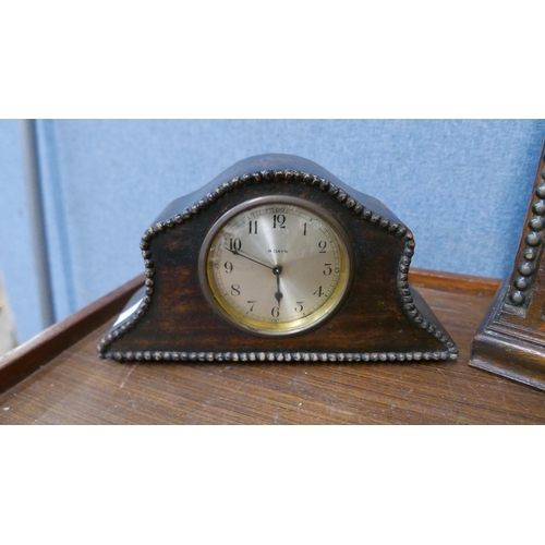 304 - Two early 20th Century carved oak mantel clocks