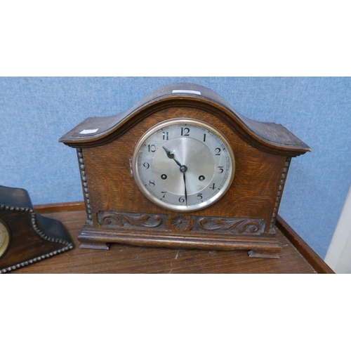 304 - Two early 20th Century carved oak mantel clocks