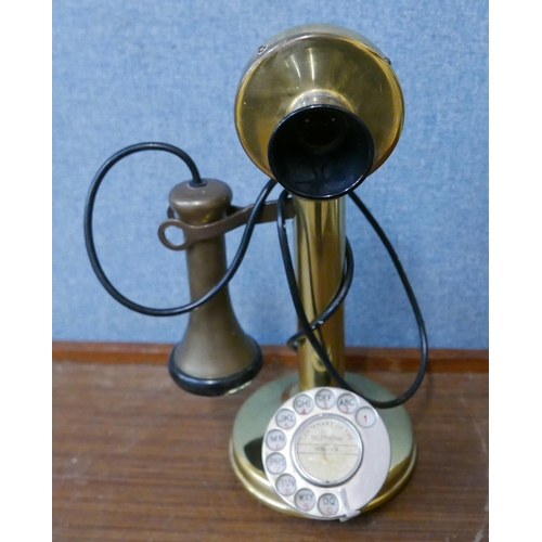 306 - A brass candlestick telephone