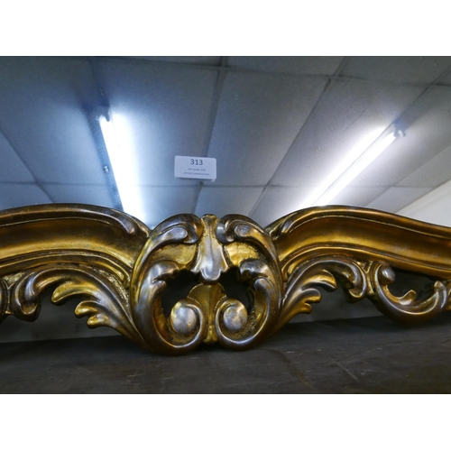 313 - A Rococo style gilt framed overmantel mirror and one other