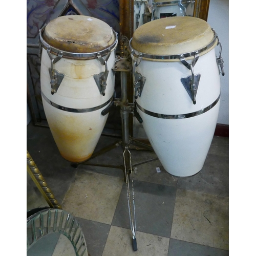 321 - A pair of percussion drums on stand