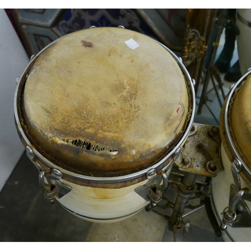 321 - A pair of percussion drums on stand